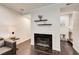 Charming living room with a fireplace and floating shelves for decor at 1105 Clairemont Ave # J, Decatur, GA 30030