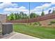 Large backyard features lush grass, a wood fence, and a visible AC unit at 1311 Park Center Cir, Austell, GA 30168