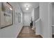 Hallway with wood-look floors and light walls leading to the home's entry at 1311 Park Center Cir, Austell, GA 30168