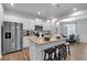 Spacious kitchen boasts stainless appliances, granite island, and seamless flow into dining area at 1311 Park Center Cir, Austell, GA 30168