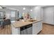Kitchen island view offers granite countertops, stainless steel appliances, and seamless transition to living area at 1311 Park Center Cir, Austell, GA 30168