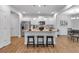 Island kitchen with stainless steel appliances and granite countertop open to the living area at 1311 Park Center Cir, Austell, GA 30168