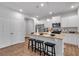 Kitchen features an island with granite countertops, seating, and modern stainless steel appliances at 1311 Park Center Cir, Austell, GA 30168