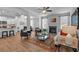 Open-concept living room featuring a fireplace, ceiling fan, and view of the kitchen at 1311 Park Center Cir, Austell, GA 30168