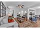 Open-concept living room with an area rug and a view of the home's kitchen at 1311 Park Center Cir, Austell, GA 30168