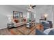 Living room featuring a neutral sofa, a black-framed mirror, and views of other rooms at 1311 Park Center Cir, Austell, GA 30168