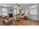 Living room with a decorative fireplace, a neutral sofa, and an area rug at 1311 Park Center Cir, Austell, GA 30168