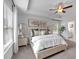 Elegant main bedroom with tray ceiling, a ceiling fan, large windows, and a neutral color scheme at 1311 Park Center Cir, Austell, GA 30168