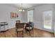 Well-lit home office with stylish light fixture and light wood flooring throughout the workspace at 1311 Park Center Cir, Austell, GA 30168