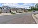 A street view showcasing a row of newly constructed townhomes with two-car garages at 1311 Park Center Cir, Austell, GA 30168