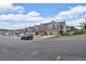 Street view of new townhomes, each with a two-car garage and similar exterior design at 1311 Park Center Cir, Austell, GA 30168
