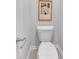 Close-up of a toilet in a modern bathroom with a paper holder at 1311 Park Center Cir, Austell, GA 30168