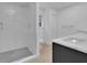 Modern bathroom with a glass-enclosed shower featuring sleek tile work and contemporary fixtures at 1770 Austin Dr, Decatur, GA 30032