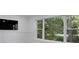 Living room with a large window with views of a wooded backyard at 1770 Austin Dr, Decatur, GA 30032