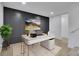Stylish home office with a modern desk, black accent wall, and a cozy rug at 1770 Austin Dr, Decatur, GA 30032