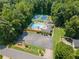 Aerial view of community amenities including pool and tennis courts surrounded by lush landscaping at 2941 Foothill Trl, Marietta, GA 30066
