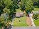 Aerial view of the property showcasing a home surrounded by lush greenery and mature trees at 2941 Foothill Trl, Marietta, GA 30066
