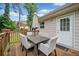 Outdoor deck with seating, an umbrella, a wood floor, and a view to the back door at 2941 Foothill Trl, Marietta, GA 30066