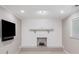 Finished basement with a fireplace, TV and a window at 2941 Foothill Trl, Marietta, GA 30066
