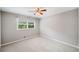 Neutral bedroom with a window, ceiling fan and plush carpeting throughout at 2941 Foothill Trl, Marietta, GA 30066