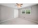 Bedroom with plush carpet, a ceiling fan, window, and white double closet at 2941 Foothill Trl, Marietta, GA 30066