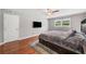Bedroom featuring hardwood floors, a ceiling fan, and a platform bed with built-in storage at 2941 Foothill Trl, Marietta, GA 30066