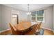 Dining room featuring a wooden table with chairs, a blue rug and a window at 2941 Foothill Trl, Marietta, GA 30066