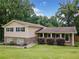 Charming home featuring a stone facade, light siding, and a well-manicured front lawn at 2941 Foothill Trl, Marietta, GA 30066