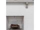 Close-up of a brick fireplace with a log at 2941 Foothill Trl, Marietta, GA 30066