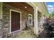 Inviting front porch with stone facade, decorative columns, and a charming stone flooring, adding curb appeal at 2941 Foothill Trl, Marietta, GA 30066