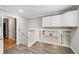 Hallway featuring wood floors, white railing, and an open view of the living room at 2941 Foothill Trl, Marietta, GA 30066