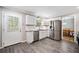 Bright kitchen with white cabinets, stainless steel appliances, and view into the dining area at 2941 Foothill Trl, Marietta, GA 30066