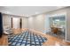 Cozy living room area featuring hardwood floors and views to the dining room and staircase at 2941 Foothill Trl, Marietta, GA 30066