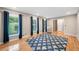 Bright living room with hardwood floors and large windows dressed with striking blue curtains at 2941 Foothill Trl, Marietta, GA 30066