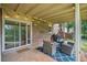 Outdoor patio with seating and string lights with a view into the backyard at 2941 Foothill Trl, Marietta, GA 30066