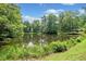 Picturesque pond surrounded by lush greenery, offering a serene and natural setting at 2941 Foothill Trl, Marietta, GA 30066