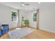 Bright bedroom with natural light, hardwood floors, and a seating area at 5601 Due West Rd, Powder Springs, GA 30127