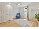 Large bedroom with hardwood floors, natural light, and blue accent chair at 5601 Due West Rd, Powder Springs, GA 30127