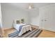 Comfortable bedroom with a ceiling fan, closet, and natural light at 5601 Due West Rd, Powder Springs, GA 30127