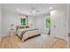 Cozy bedroom with natural light, neutral tones, and ceiling fan at 5601 Due West Rd, Powder Springs, GA 30127