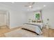 Bright bedroom with natural light, ceiling fan, and en suite bath at 5601 Due West Rd, Powder Springs, GA 30127