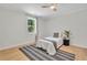Cozy bedroom with natural light, ceiling fan, and hardwood floors at 5601 Due West Rd, Powder Springs, GA 30127