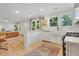 Bright and modern kitchen open to living room with white cabinetry at 5601 Due West Rd, Powder Springs, GA 30127