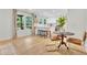 Modern kitchen featuring sleek white cabinetry, stainless steel appliances, and stylish dining area at 5601 Due West Rd, Powder Springs, GA 30127