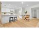 Bright, modern kitchen with white cabinets, stainless steel appliances, and a convenient breakfast bar at 5601 Due West Rd, Powder Springs, GA 30127