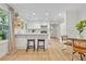 Well-lit kitchen featuring white cabinets, stainless steel appliances, and a breakfast bar at 5601 Due West Rd, Powder Springs, GA 30127