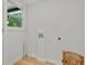 Empty Laundry room featuring hookups and a window at 5601 Due West Rd, Powder Springs, GA 30127