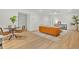 Bright living area featuring modern furniture and light wood flooring at 5601 Due West Rd, Powder Springs, GA 30127