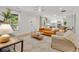 Bright open-concept living room featuring stylish decor and seamless flow to the modern kitchen at 5601 Due West Rd, Powder Springs, GA 30127