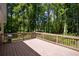 Wooden back deck overlooking a yard and a wooded area at 995 Highway 101 S, Temple, GA 30179
